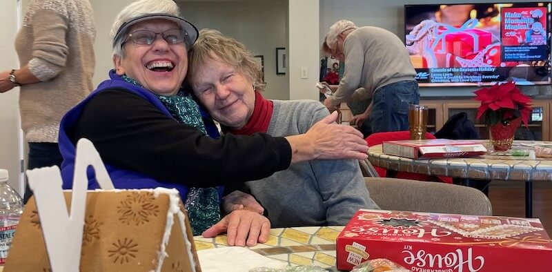 senior ladies hugging and laughing