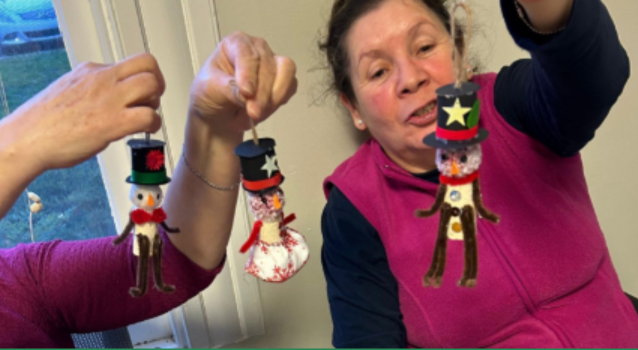 Woman holding handmade holiday ornaments
